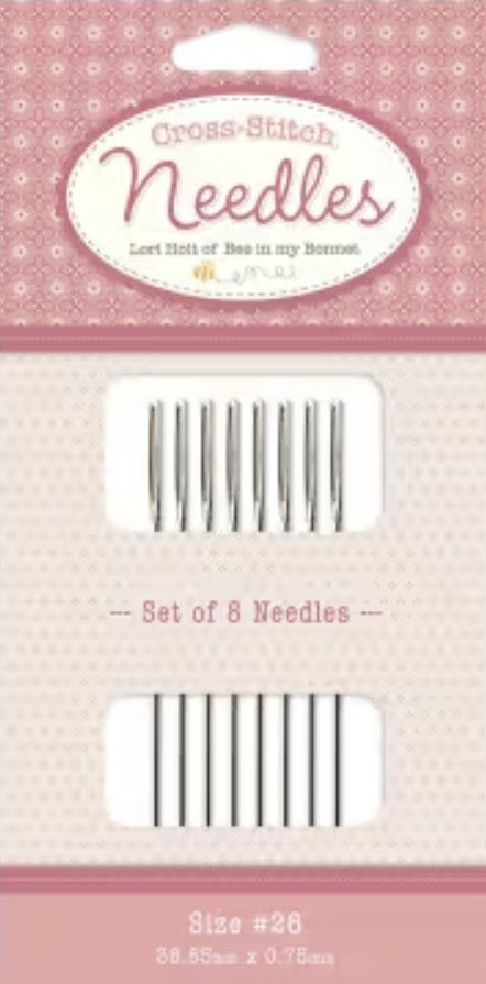 Pack of cross-stitch needles with a decorative pink and white label.