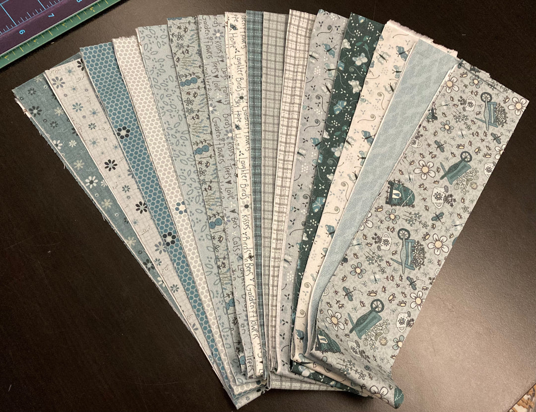 16 x 2 1/2" strips from Lynette's 'Something Borrowed, Something Blue' fabric collection.