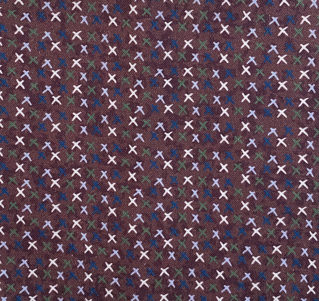 Peace and Joy 80620-7 Love and Kisses - burgundy cotton fabric with white, green, navy and light blue x's