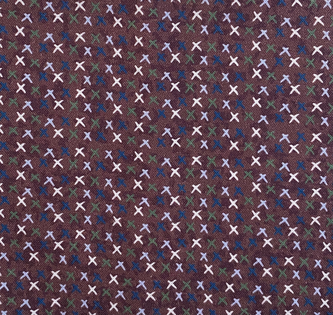 Peace and Joy 80620-7 Love and Kisses - burgundy cotton fabric with white, green, navy and light blue x's