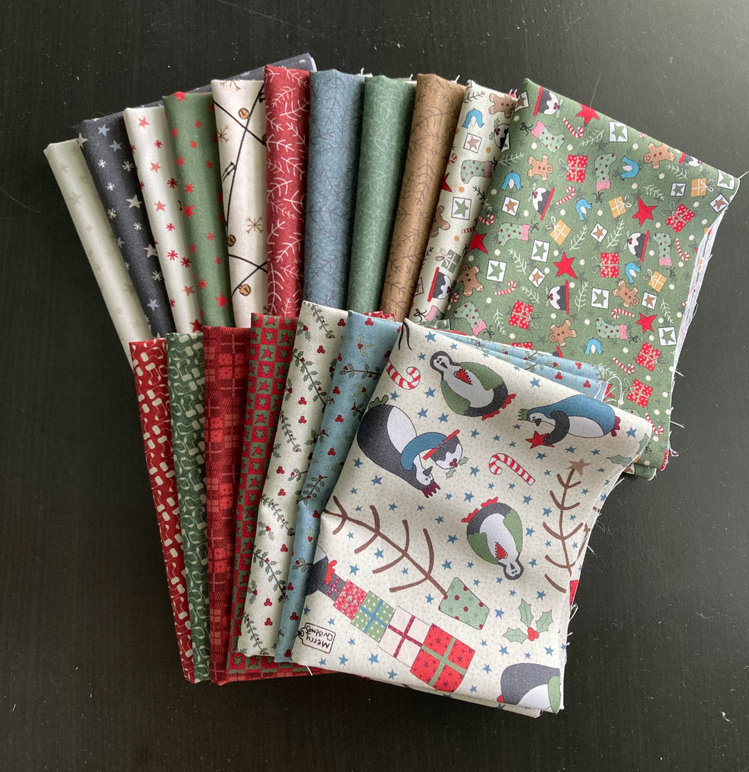 A collection of 18 different fabric pieces from the Three Wise Penguins fabric collection, displayed folded on a surface.